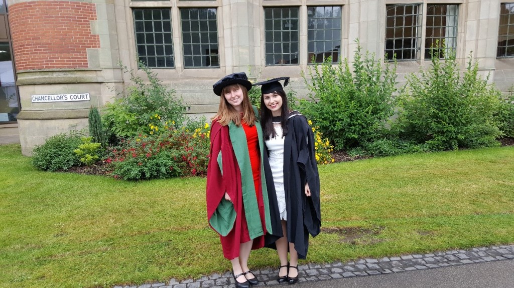 A person standing in front of a building

Description automatically generated