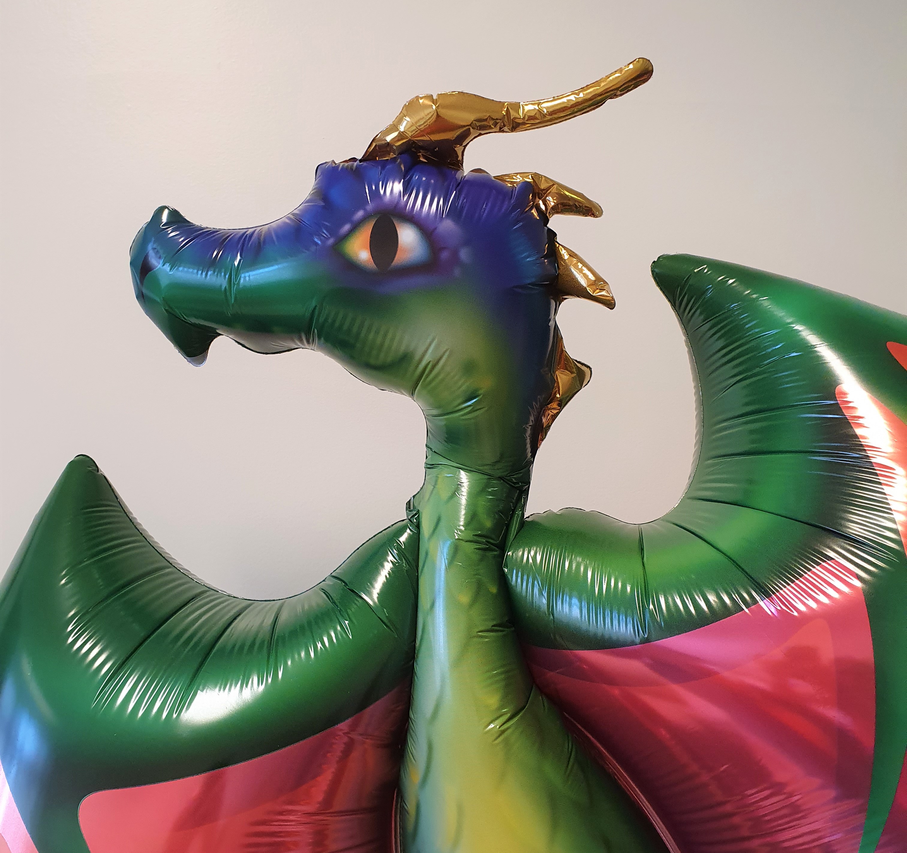 A green balloon dragon.